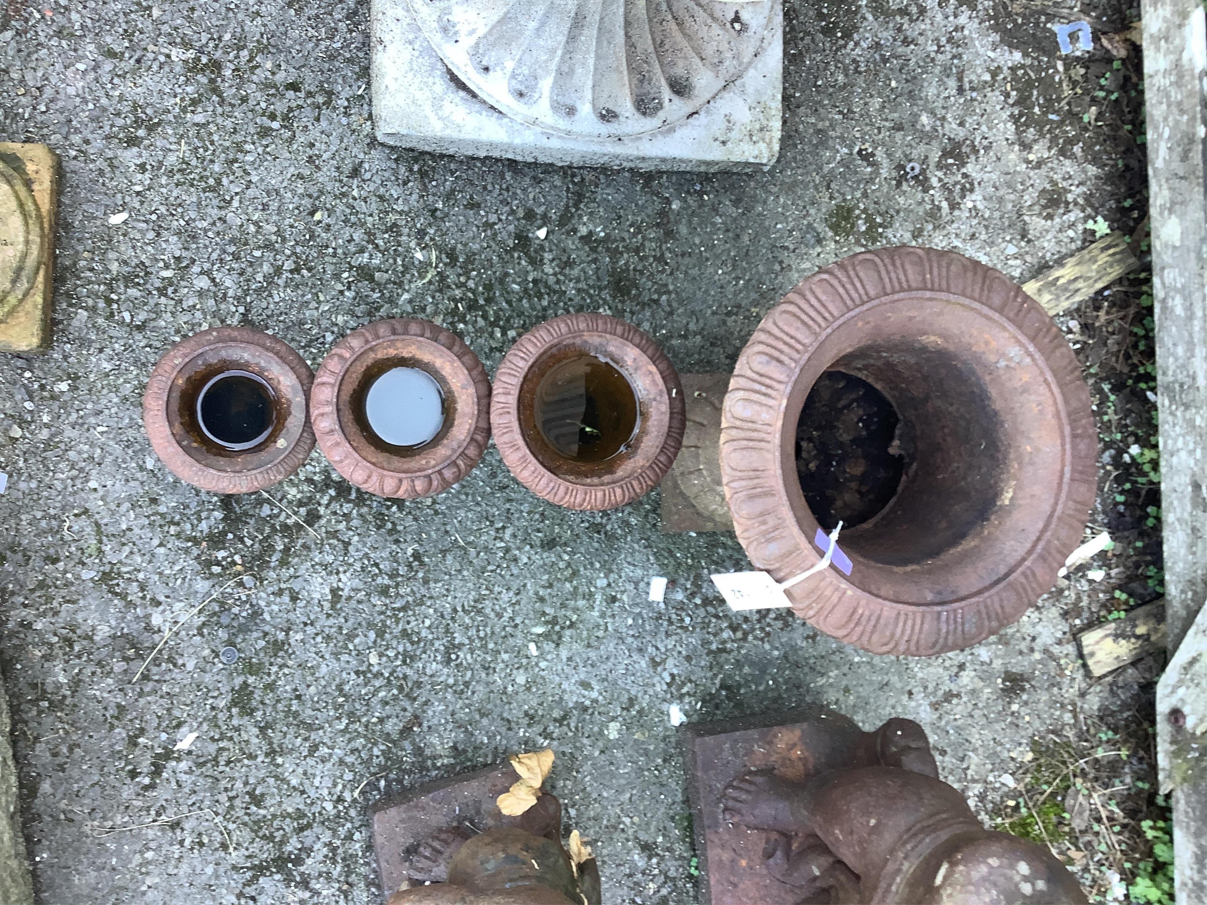 Four Victorian style cast iron campana garden urns, largest height 42cm. Condition - fair